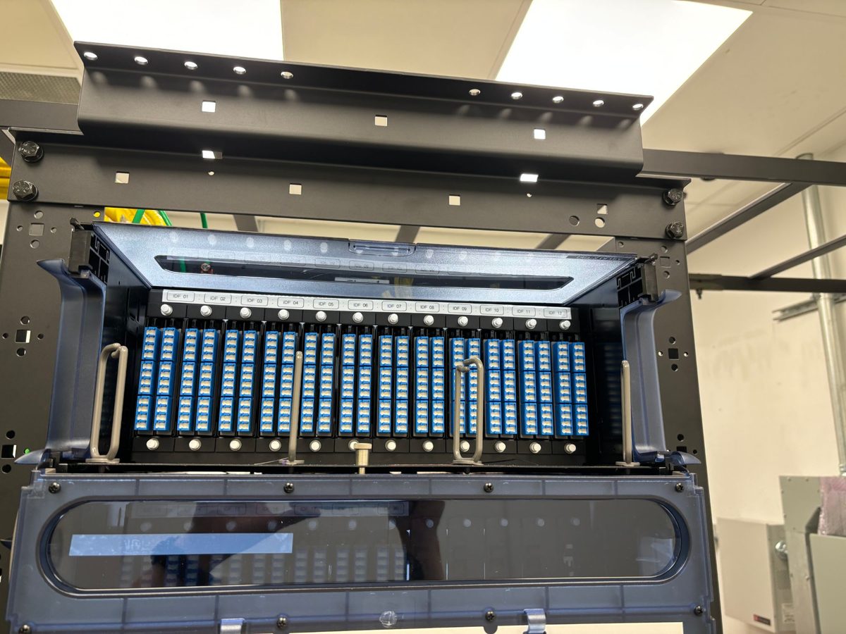 Rack-mount fiber enclosure with LC duplex adapter panels labeled IDF 01 to IDF 12